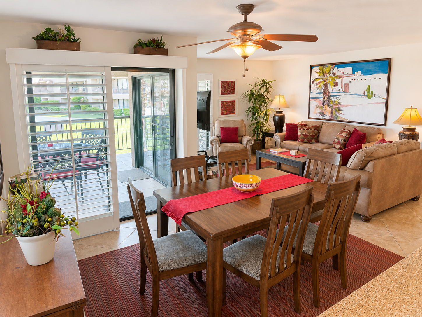Dining area opening into the living room and patio